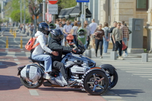 Three wheels vehicle waiting at the crossing